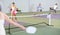 Concentrated young girl pickleball player waiting to receive serve