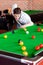 Concentrated young man playing snooker