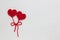 The concept for 14 February, romantic Valentine day. Love affair, love story. Red crochet wool heart and ribbon on white crochet