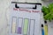 Concept of 3rd Quarterly Report write on paperwork and bar graph isolated on Wooden Table