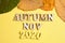 The concept of autumn - November in the new year. Wooden numbers 2020 with letters, leaves on a yellow background. Top view