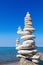 Concept of balance and harmony. White rocks zen on the background of sea and blue sky