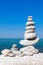 Concept of balance and harmony. White rocks zen on the sea
