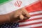 Concept of bilateral relations of US and Iran deal showing with flag and hands showing of deal gesture