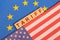 Concept of Bilateral relations and US tariff on EU showing with flags
