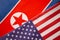 Concept of Bilateral relationship between two countries showing with two flags: United States of America and North Korea