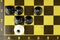 Concept, black pawns checkmate a white king top view