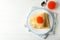 Concept of breakfast with plate of crepes with red caviar on white wooden table