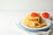 Concept of breakfast with plate of crepes with red caviar on white wooden table