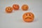 Concept of bullying, discrimination. Group of laughing emoticon faces and one alone look sad and depressed. Lemmons and mandarines