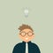 Concept of business idea: Smiling man accountant or auditor with included burning light bulb above head as a metaphor or symbol of