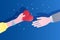 Concept of charity and donation. Give and share your love to people. The hand of the woman gives the symbol of heart to