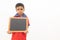 Concept of child protest showing with young boy holding black slate on isolated background.