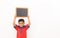 Concept of child protest showing with young boy holding black slate on isolated background.