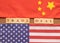 Concept of China US Trade deal, Trade Deal Printed on Wooden block letters in between China and US Flags