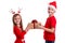 Concept: Christmas or Happy New Year holiday. Happy boy with santa hat on his head and a girl with deer horns, holding