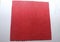 Concept of cleaning of premises, offices and houses. Tools for restoring order and cleanliness. A red microfiber rag with scallope