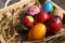 Concept, colorful fancy easter eggs in wooden box