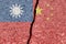 The concept of conflict and crisis between China and Taiwan. Crack between Chinese and Taiwanese flags.