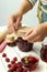 Concept of cooking raspberry jam on white wooden table