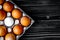 Concept of correct choice eggs on wooden background top view