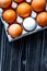 Concept of correct choice eggs on wooden background top view