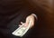 The concept of corruption and bribery, law and money. Dark business. Businessman receives money - Bribe in the form of dollar