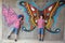 Concept of creativity child. Little boys stands next to a wall with painted butterflies