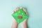 Concept of DIY and kid`s creativity, origami. Step by step instruction: how to make bookmark as christmas tree. Step 9 Child`s