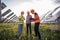 Concept of ecological innovation and green energy happy woman ecological engineer and two investors discussing about the