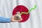 The concept of economic growth in the country Japan. Hand holds a bag with money and an upward arrow