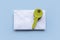 Concept of email security, secure communication, secret and confidential. Key above white envolope over a blue background