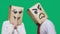 The concept of emotions and gestures. Two people in paper bags with a smile. Aggressive smiley swears. The second looks