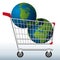 Concept of excessive exploitation of natural resources of the earth with two planets in a shopping cart to symbolize the danger.