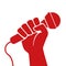 Concept of the fight for freedom of information with a raised fist holding a microphone.