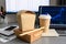 The concept of food delivery to the office to the workplace. Paper containers for food and wooden chopsticks on the table