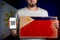 Concept of freedoms and human rights. A man with a cardboard and a phone in his hand. The Flag of Philippines. Copy space and mock