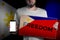 Concept of freedoms and human rights. A man with a cardboard and a phone in his hand. The Flag of Philippines. Mock up