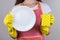 Concept of good detergent. Cropped close up photo of positive cheerful glad lady wife showing pure clear white plate dishcloth in