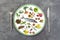 Concept of good food, in a plate, food, diet balance on a grey slate background