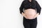 Concept of health pregnancy,  Cropped of pregnant woman standing on white background. With copy space for your text.