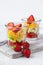 Concept of healthy food, clean eating. Low calories colorful sweet summer dessert. Homemade simple fruit salad, ideal breakfast.