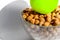 The concept of a healthy lifestyle, treatment of diseases and proper nutrition and dietetics. Green Apple on a bowl of bran in the