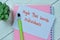 Concept of High Net Worth Individuals write on sticky notes isolated on Wooden Table