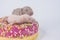 The concept of home recipe. sweets. Newborn baby cub in a donut