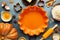 Concept homemade fall baking with pumpkin, food ingredients, spices and kitchen utencil. Cooking pumpkin pie and cookies for