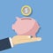Concept illustration of saving money. Pink piggy piggy bank and a coin or money in the hand of a person. Flat vector