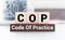 Concept image of Business Acronym COP Code Of Practice written on wooden block