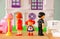 Concept image of parent busy or angry and child in the middle in front of. little plastic toy dolls (male , female, child) , selec