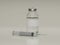 Concept image of syringe beside vaccine in clear class container with blank white label on beige background. 3D render